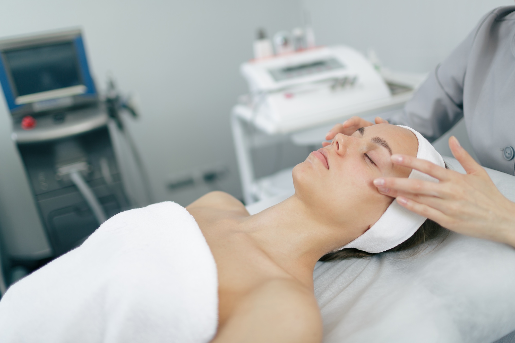Facial massage session for rejuvenation and skincare in modern beauty clinic.